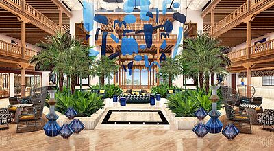 Elegante Hotellobby im Seaside Los Jameos, Lanzarote – stilvolles Interieur mit Palmen, moderner Kunst in Blau und gemütlichen Sitzbereichen im kanarischen Holzstil