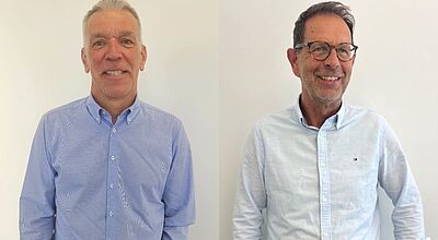 Gereon Krahn (links) und Jürgen Werf verstärken das Team des Koblenzer Veranstalters Reisen Aktuell Zwei Männer stehen nebeneinander vor einem hellen Hintergrund. Der Mann links trägt ein hellblau kariertes Hemd mit Knopfleiste und hat kurzes graues Haar. Der Mann rechts trägt ein hellblaues Hemd mit aufgerollten Ärmeln und eine Brille, er hat ebenfalls graue Haare und lächelt in die Kamera.