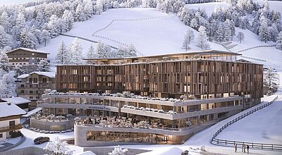 Ein Hotel in den Alpen, umgeben von schneebedeckter Landschaft