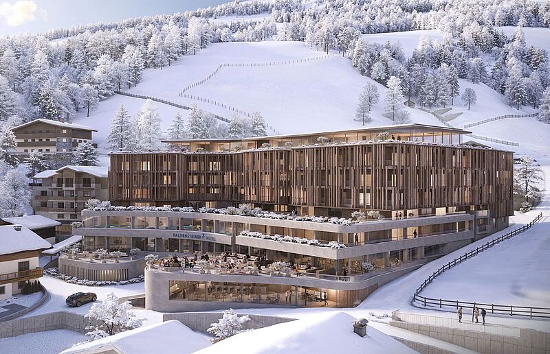 Ein Hotel in den Alpen, umgeben von schneebedeckter Landschaft