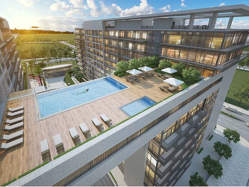 Modernes Rotana-Hotel mit spektakulärem Infinity-Pool auf der Dachterrasse, Sonnenliegen und Stadtblick bei Sonnenuntergang – luxuriöse Architektur und exklusives Design in urbaner Umgebung.