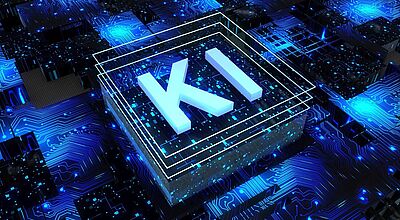 Digitales Konzeptbild mit dem Schriftzug „KI“ (für Künstliche Intelligenz) in leuchtenden, dreidimensionalen Buchstaben auf einem stilisierten Mikrochip-Hintergrund. Die Umgebung ist von blauen Leiterbahnen, Datenpunkten und leuchtenden Schaltkreisen geprägt, was eine Hightech-Atmosphäre vermittelt.