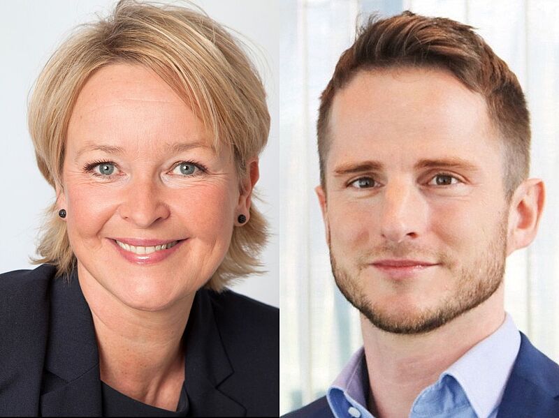 Zwei Geschäftspersonen posieren für Porträtfotos. Links eine lächelnde Frau mit kurzen blonden Haaren, dunklem Blazer und schwarzen Ohrringen vor hellem Hintergrund. Rechts ein lächelnder Mann mit kurzem braunem Haar, leichtem Bart und blauem Anzug mit hellblauem Hemd vor einem lichtdurchfluteten Hintergrund.