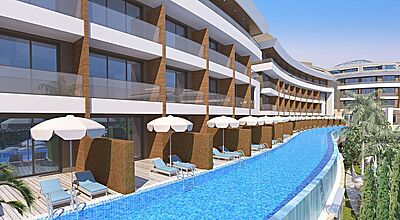 Modernes Luxus-Hotel mit direktem Poolzugang von den Zimmern, Sonnenterrassen mit Liegestühlen und Sonnenschirmen, ideal für exklusiven Urlaub am Infinity-Pool unter Palmen