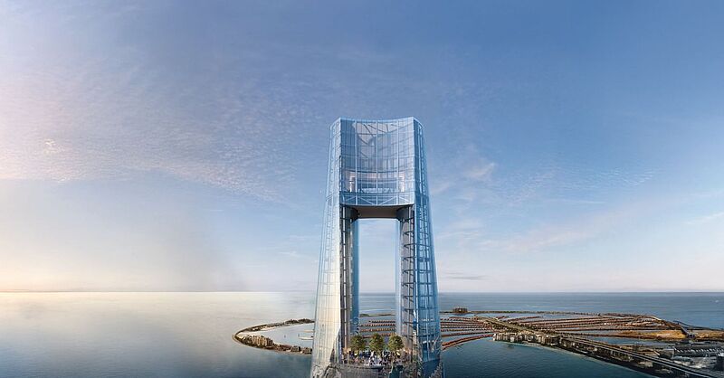 Futuristischer Wolkenkratzer mit Glasfassade an der Küste von Dubai mit Panoramablick über das Meer und die künstliche Insel Palm Jumeirah – modernes Architektur- und Reise-Highlight