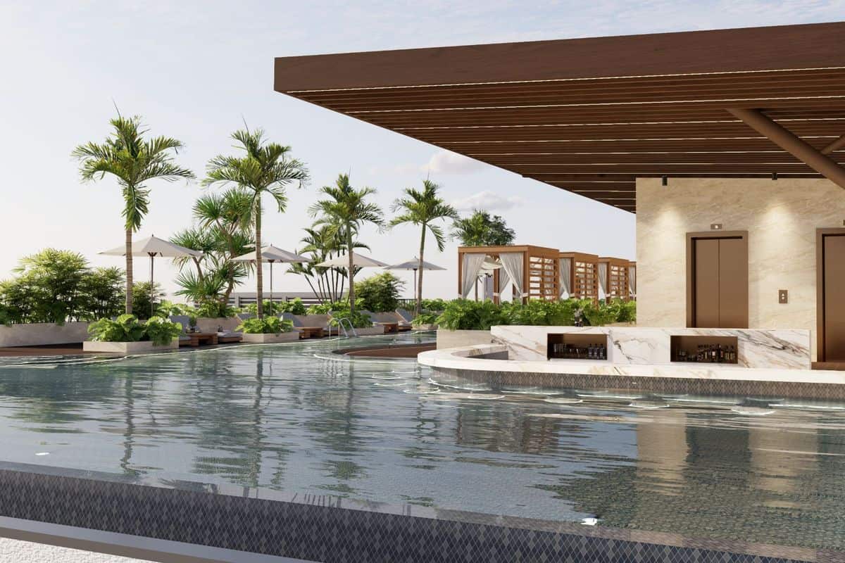 Moderne Poollandschaft mit Palmen, Liegen und einem eleganten Gebäude im Hintergrund, das eine entspannende Atmosphäre vermittelt.