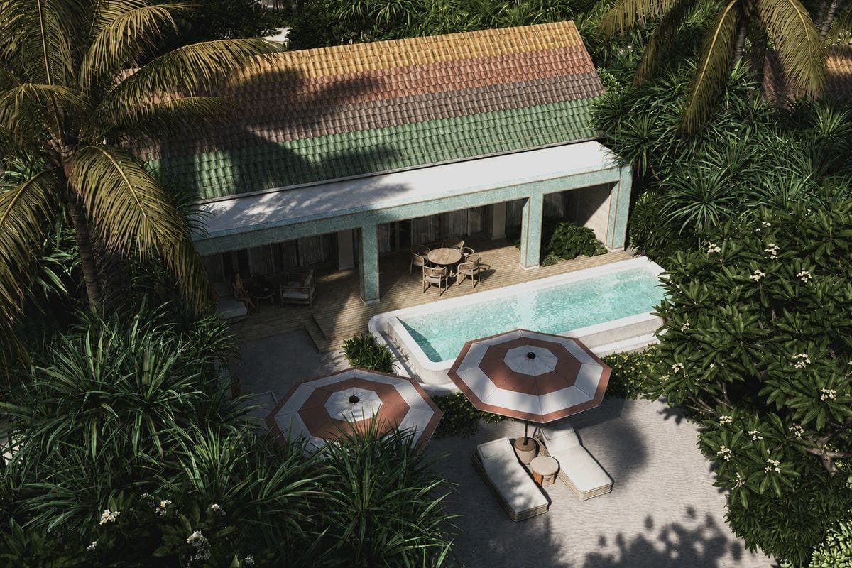 Luftaufnahme einer Villa mit buntem Ziegeldach, privatem Pool, Terrasse mit Sitzgruppe sowie zwei Sonnenschirmen mit Liegen in einem tropischen Garten.