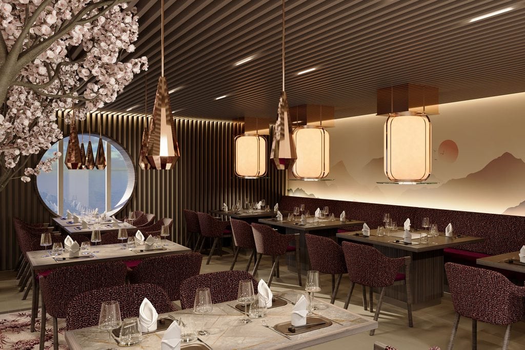 Innenansicht eines eleganten Restaurants mit Kirschblütenbaum, runden Fenstern, modernen Pendelleuchten und gedeckten Tischen mit Stühlen in dunklem Design.