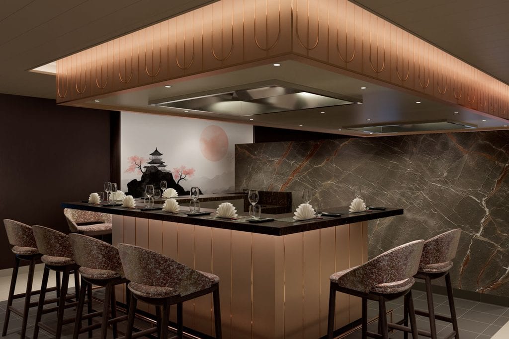 Eine U-förmige Bar mit kupferfarbenen Elementen, Barhockern mit gemustertem Stoffbezug und einer Wandgestaltung mit japanischem Motiv und dunklem Marmor.